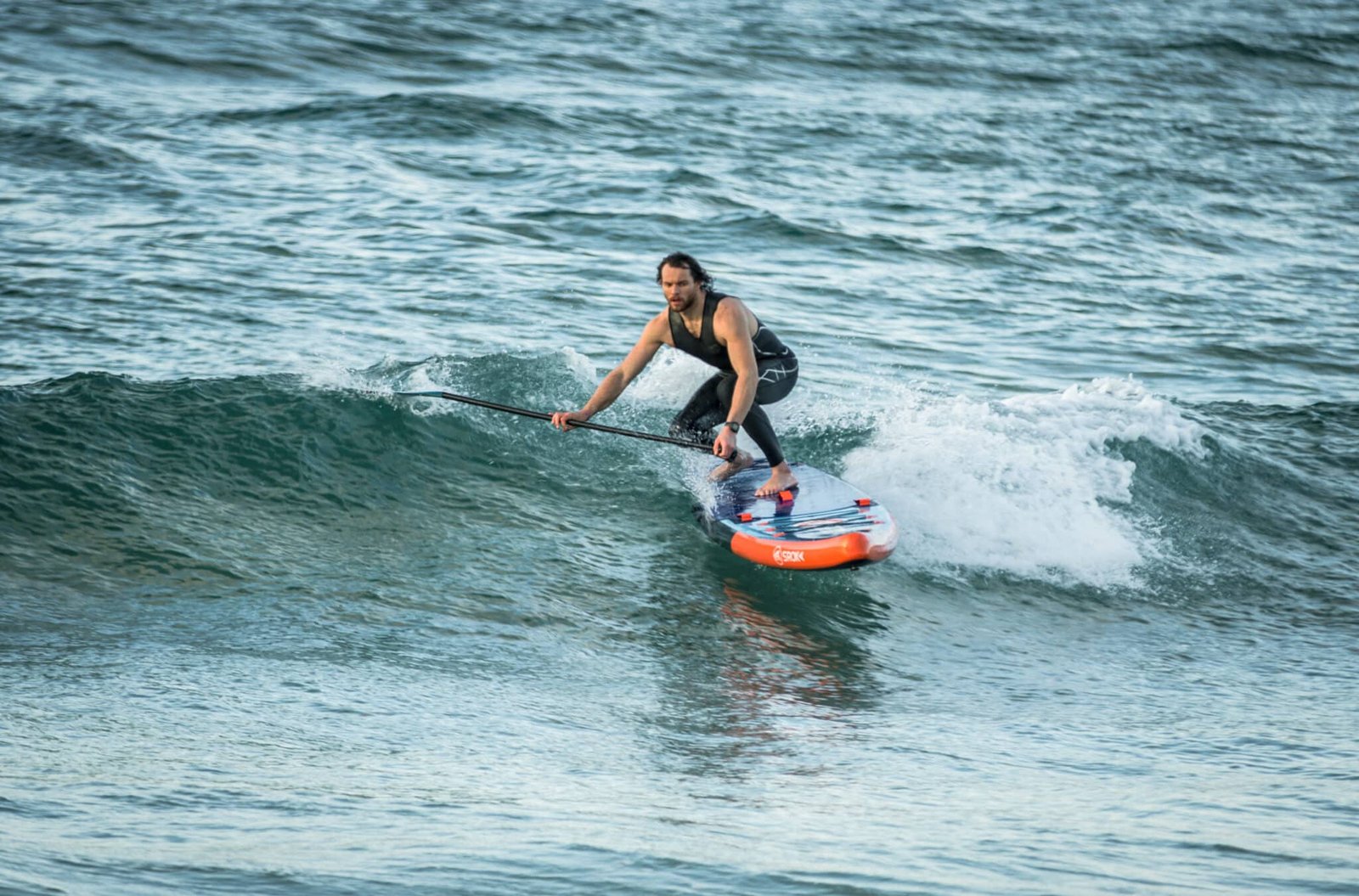 SUP Surfing: Combining Stand-Up Paddleboarding with Wave Riding